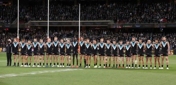 Port players line up for the National Anthem during the 2021 AFL Second Preliminary Final match between the Port Adelaide Power and the Western...