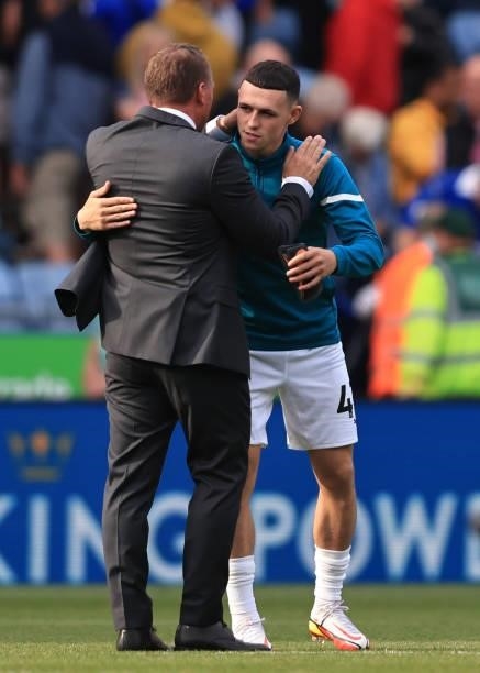 Leicester City manager Brendan Rodgers with Phil Foden of Manchester City during the Premier League match between Leicester City and Manchester City...