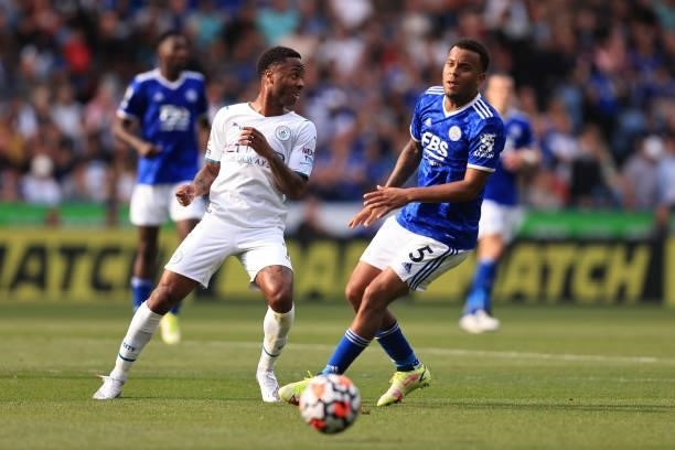 Ryan Bertrand of Leicester City tangles with Raheem Sterling of Manchester City during the Premier League match between Leicester City and Manchester...