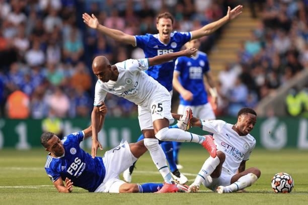 Fernandinho and Raheem Sterling of Manchester City in action with Youri Tielemans and Jonny Evans of Leicester City during the Premier League match...
