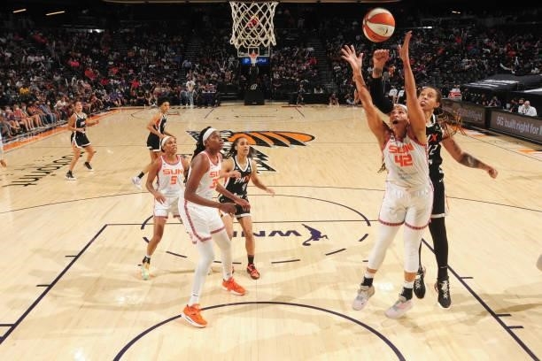 Brionna Jones of the Connecticut Sun and Brittney Griner of the Phoenix Mercury reach for the ball during the game on September 11, 2021 at Footprint...