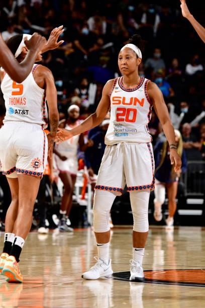 Briann January of the Connecticut Sun high-fives teammates during the game against the Phoenix Mercury on September 11, 2021 at Footprint Center in...