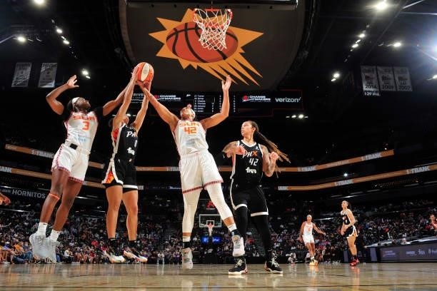 Kaila Charles and Brionna Jones of the Connecticut Sun reach for a rebound during the game against the Phoenix Mercury on September 11, 2021 at...