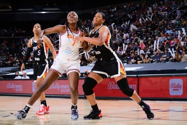 Beatrice Mompremier of the Connecticut Sun and Kia Vaughn of the Phoenix Mercury fight for position during the game on September 11, 2021 at...