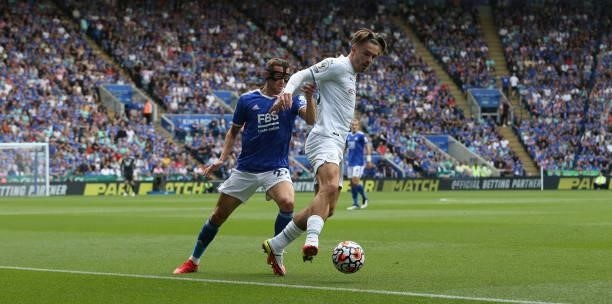 Manchester City's Jack Grealish shields the ball from Leicester City's Timothy Castagne during the Premier League match between Leicester City and...