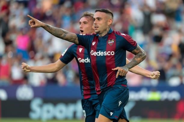 Levante's forward Roger Marti celebrate after scoring the 1-0 goal with his teammate during La liga match between Levante UD and Rayo Vallecano at...