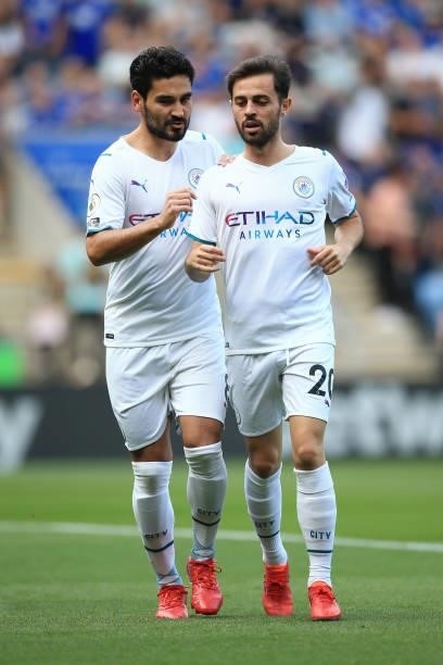 Ilkay Gundogan of Manchester City talks to Bernardo Silva of Manchester City during the Premier League match between Leicester City and Manchester...
