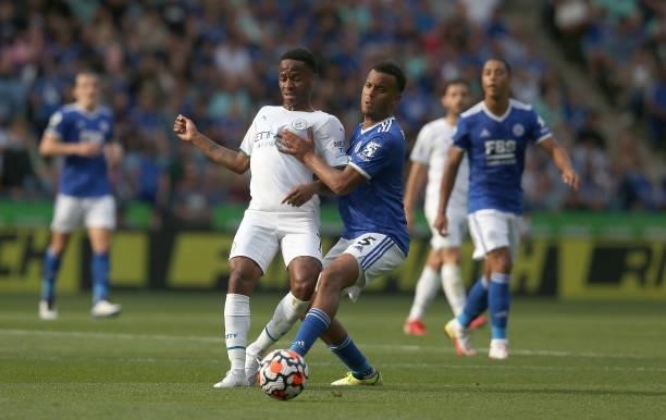 Manchester City's Raheem Sterling battles with Leicester City's Ryan Bertrand during the Premier League match between Leicester City and Manchester...