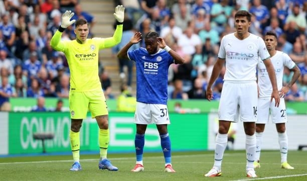 Manchester City's Ederson Santana de Moraes and Leicester City's Ademola Lookman during the Premier League match between Leicester City and...