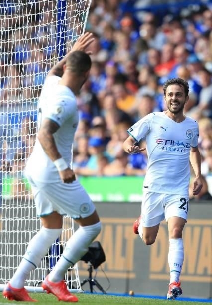 Manchester City's Portuguese midfielder Bernardo Silva celebrates with Manchester City's English defender Kyle Walker after scoring the opening goal...