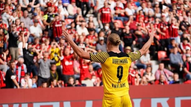 September 11: Erling Haaland of Borussia Dortmund celebrates after scoring his team's fourth goal during the Bundesliga match between Bayer 04...