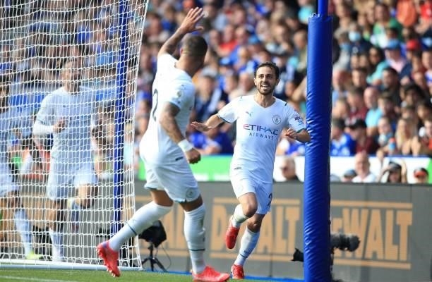 Manchester City's Portuguese midfielder Bernardo Silva celebrates with Manchester City's English defender Kyle Walker after scoring the opening goal...