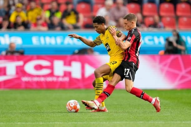 September 11: Jude Bellingham of Borussia Dortmund and Florian Wirtz of Bayer 04 Leverkusen battle for the ball during the Bundesliga match between...