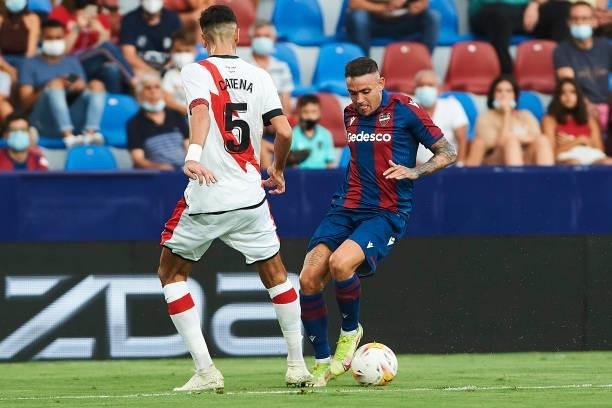Roger Marti of UD Levante and Alejandro Catena of Rayo Vallecano battle for the ball during the LaLiga Santander match between Levante UD and Rayo...