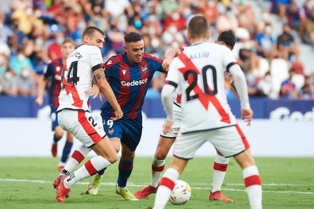 Roger Marti of UD Levante and Mario Suarez of Rayo Vallecano battle for the ball during the LaLiga Santander match between Levante UD and Rayo...