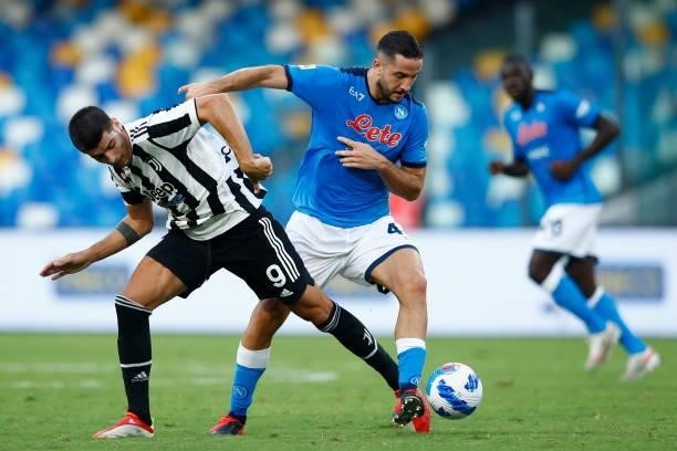 Alvaro Morata of Juventus and Kostantinos Manolas of SSC Napoli battle for the ball during the Serie A match between SSC Napoli and Juventus FC at...