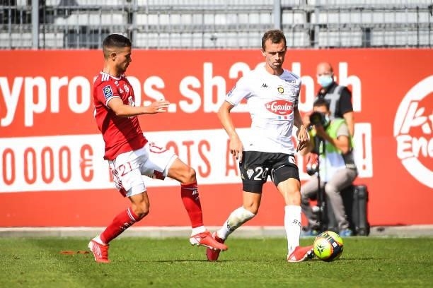 Romain FAIVRE of Brest and Romain THOMAS of Angers during the Ligue 1 Uber Eats match between Brest and Angers at Stade Francis Le Ble on September...