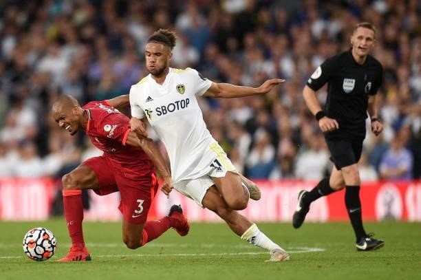 Liverpool's Brazilian midfielder Fabinho vies for the ball against Leeds United's Welsh striker Tyler Roberts during the English Premier League...