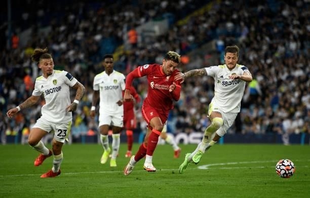 Liverpool's English midfielder Alex Oxlade-Chamberlain vies for the ball against Leeds United's English-born Scottish defender Liam Cooper during the...