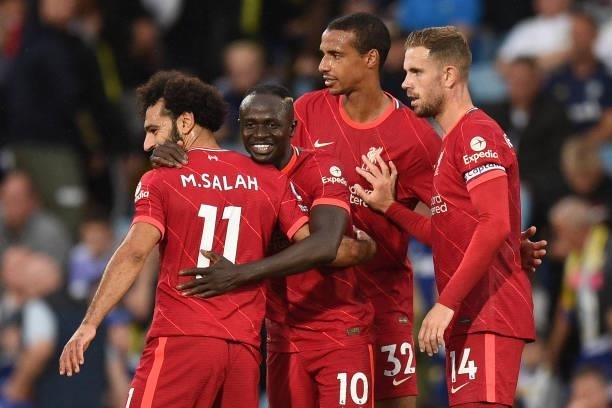Liverpool's Senegalese striker Sadio Mane celebrates scoring his team's third goal with Liverpool's Egyptian midfielder Mohamed Salah during the...