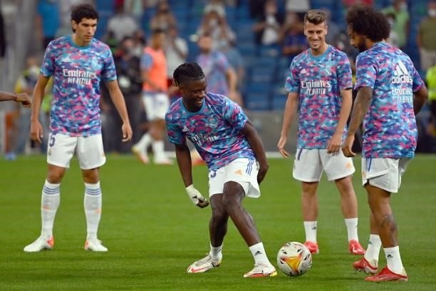 Real Madrid's French midfielder Eduardo Camavinga warms up with teammates before the Spanish League football match between Real Madrid CF and RC...