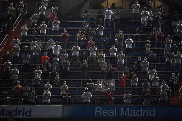 People applaud from the grandstands before the Spanish League football match between Real Madrid CF and RC Celta de Vigo at the Santiago Bernabeu...