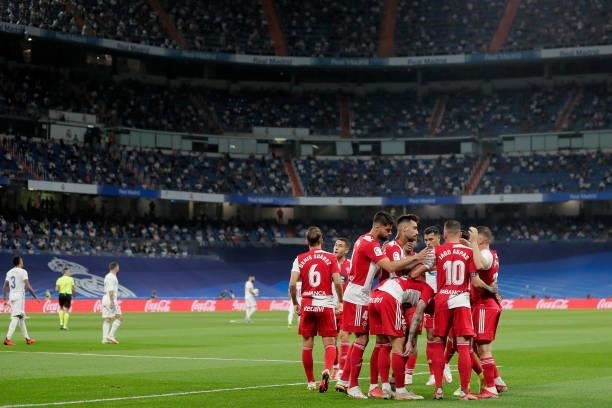 Santi Mina of Celta de Vigo celebrates 0-1 with teammates during the La Liga Santander match between Real Madrid v Celta de Vigo at the Estadio...