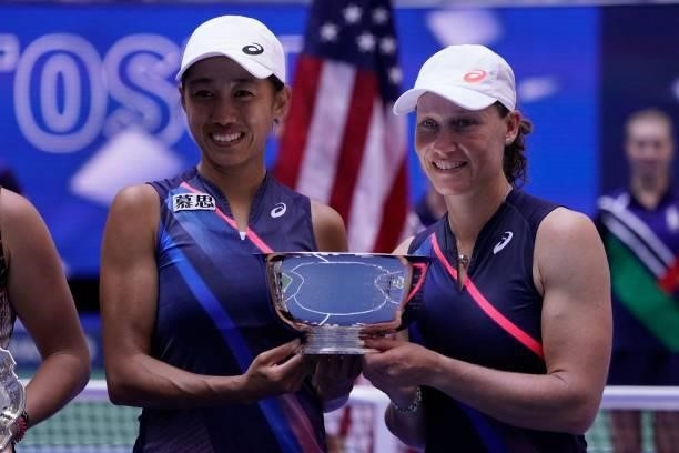 China's Shuai Zhang and Australia's Samantha Stosur pose with the trophy after winning the 2021 US Open Tennis tournament women's doubles final match...