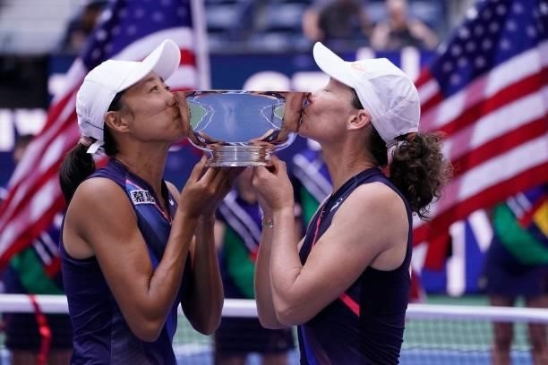 China's Shuai Zhang and Australia's Samantha Stosur celebrate with the trophy after winning the 2021 US Open Tennis tournament women's doubles final...