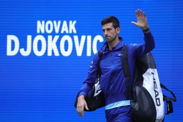 Serbia's Novak Djokovic waves to crowd as he arrives for his match against Russia's Daniil Medvedev during their 2021 US Open Tennis tournament men's...