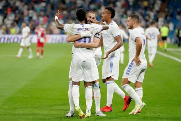 Vinicius Junior of Real Madrid celebrates 3-2 with Karim Benzema of Real Madrid during the La Liga Santander match between Real Madrid v Celta de...