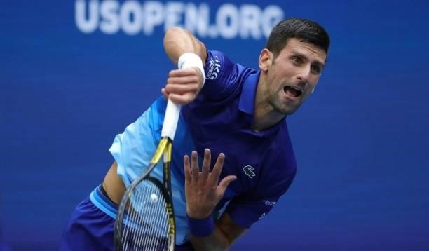 Novak Djokovic of Serbia serves against Daniil Medvedev of Russia in the first set of the Men's Singles final match at the USTA Billie Jean King...