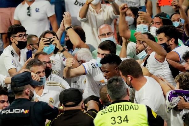 Vinicius Junior of Real Madrid celebrates 3-2 with supporters during the La Liga Santander match between Real Madrid v Celta de Vigo at the Estadio...