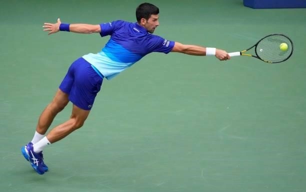 Serbia's Novak Djokovic hits a return to Russia's Daniil Medvedev during their 2021 US Open Tennis tournament men's final match at the USTA Billie...