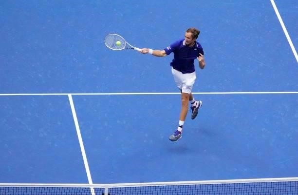 Russia's Daniil Medvedev hits a return to Serbia's Novak Djokovic during their 2021 US Open Tennis tournament men's final match at the USTA Billie...