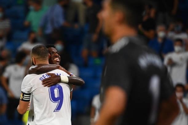 Real Madrid's French forward Karim Benzema celebrates scoring his team's fifth goal with Real Madrid's Brazilian forward Vinicius Junior during the...