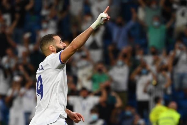 Real Madrid's French forward Karim Benzema celebrates scoring his team's fifth goal during the Spanish League football match between Real Madrid CF...