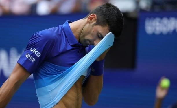 Novak Djokovic of Serbia reacts as he plays against Daniil Medvedev of Russia in the first set of the Men's Singles final match at the USTA Billie...