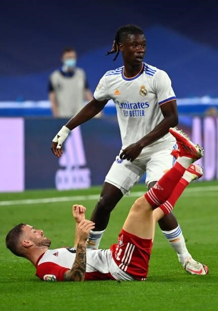 Celta Vigo's Argentinian midfielder Franco Cervi falls down in front of Real Madrid's French midfielder Eduardo Camavinga during the Spanish League...