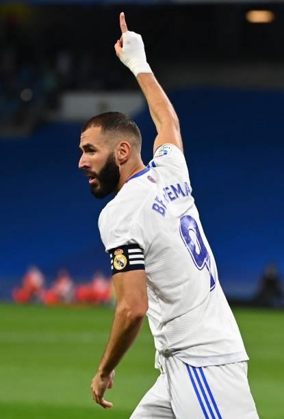 Real Madrid's French forward Karim Benzema celebrates scoring his team's second goal during the Spanish League football match between Real Madrid CF...
