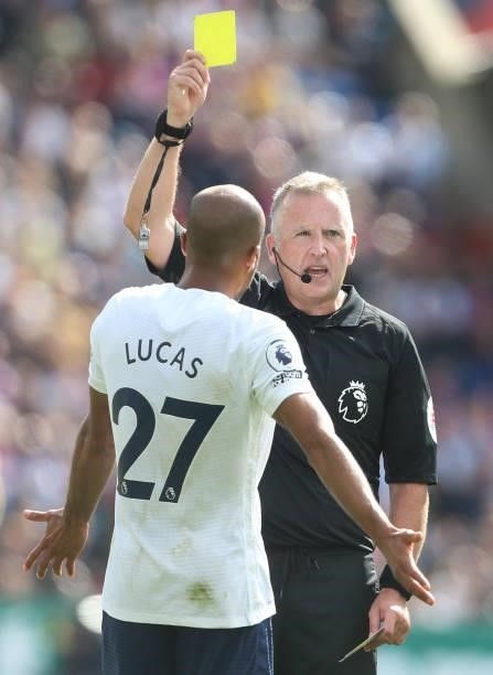 Referee Jonathan Moss shows Tottenham Hotspur's Lucas Moura a yellow card during the Premier League match between Crystal Palace and Tottenham...