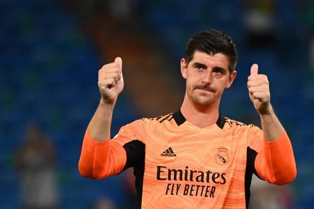 Real Madrid's Belgian goalkeeper Thibaut Courtois celebrates his team's victory at the end of the Spanish League football match between Real Madrid...