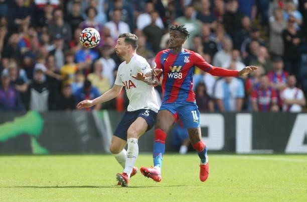 Tottenham Hotspur's Pierre-Emile Hojbjerg and Crystal Palace's Wilfried Zaha during the Premier League match between Crystal Palace and Tottenham...