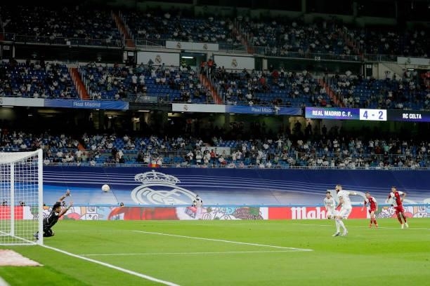 Karim Benzema of Real Madrid scores the seventh goal to make it 5-2 during the La Liga Santander match between Real Madrid v Celta de Vigo at the...