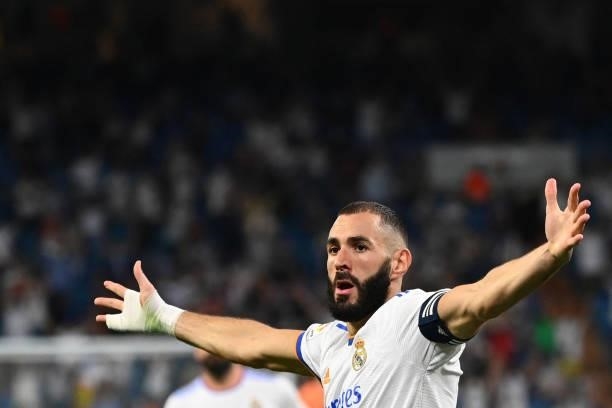 Real Madrid's French forward Karim Benzema celebrates scoring his team's second goal during the Spanish League football match between Real Madrid CF...