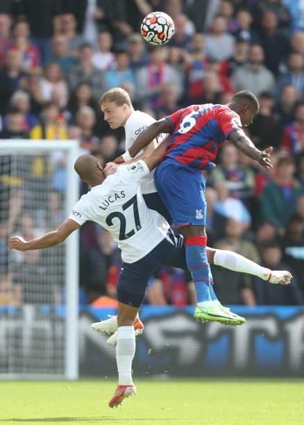Crystal Palace's Marc Guehi challenges Tottenham Hotspur's Lucas Moura and Oliver Skipp during the Premier League match between Crystal Palace and...