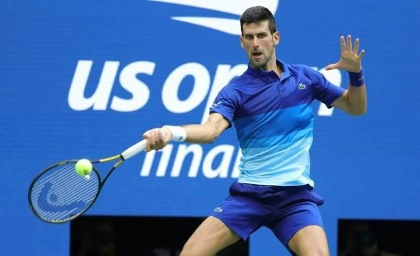 Novak Djokovic of Serbia returns the ball against Daniil Medvedev of Russia in the second set of the Men's Singles final match at the USTA Billie...