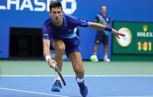 Novak Djokovic of Serbia returns the ball against Daniil Medvedev of Russia in the first set of the Men's Singles final match at the USTA Billie Jean...