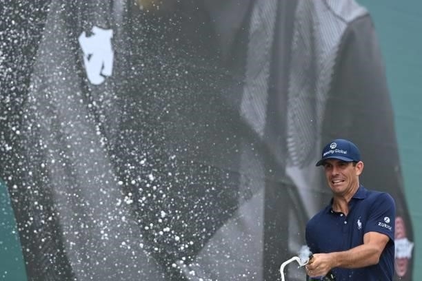 Golfer Billy Horschel sprays champagne as he celebrates his victory in the PGA Championship at Wentworth Golf Club in Surrey, south west of London on...