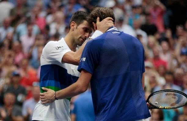 Russia's Daniil Medvedev greets Serbia's Novak Djokovic at the net after winning during their 2021 US Open Tennis tournament men's final match at the...